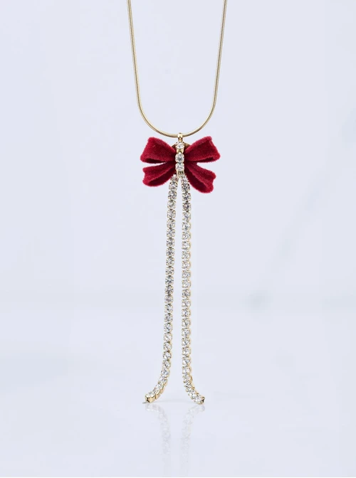 Naszyjnik kokardka, kryształki, stal pozłacana S308185Z03