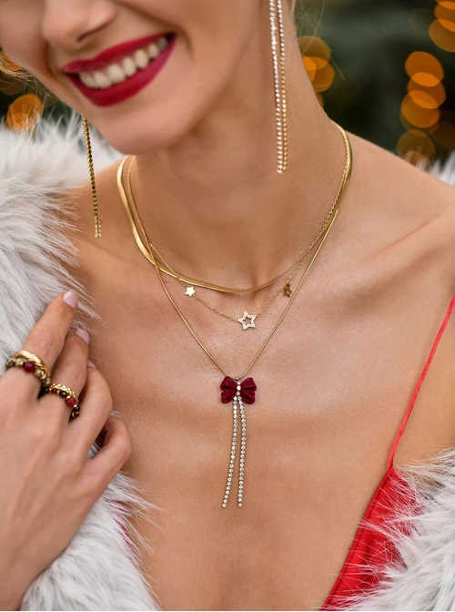 Naszyjnik kokardka, kryształki, stal pozłacana S308185Z03