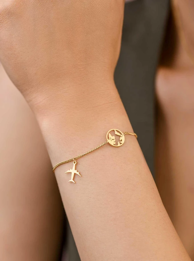 Bransoletka mapa świata, samolot, stal pozłacana S109511Z00