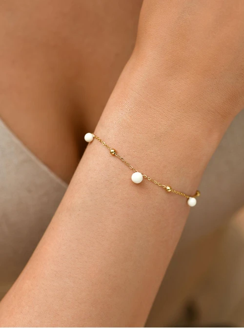 Bransoletka białe kuleczki, stal pozłacana S109452Z02