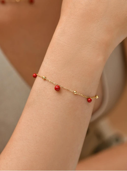 Bransoletka czerwone kuleczki, stal pozłacana S109452Z03
