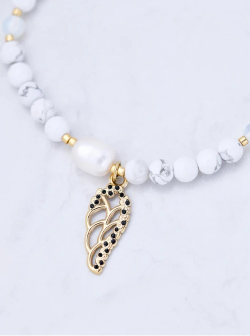 Bransoletka skrzydełko, perełka, Howlit, stal pozłacana S109399Z01