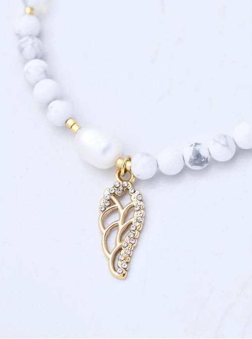 Bransoletka skrzydełko, perełka, Howlit, stal pozłacana S109399Z02