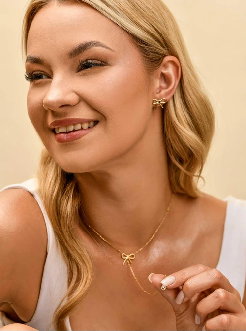 Naszyjnik krawatka, kokardka, stal pozłacana S309897Z00