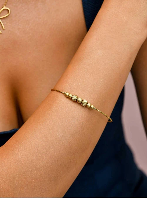 Bransoletka kuleczki, serduszko, stal pozłacana S110697Z00