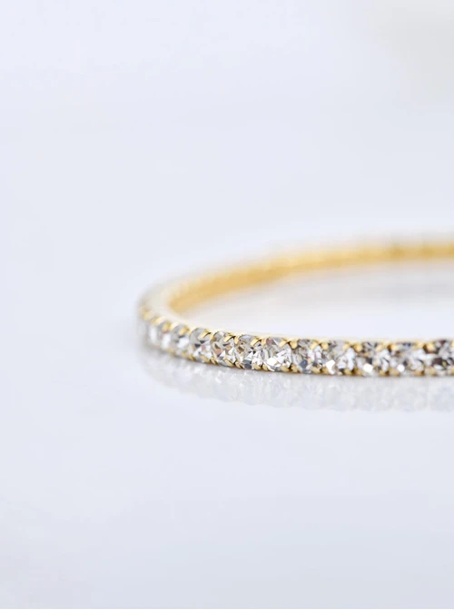 Bransoletka tenisowa z kryształkami, elastyczna, stal pozłacana S110266Z02