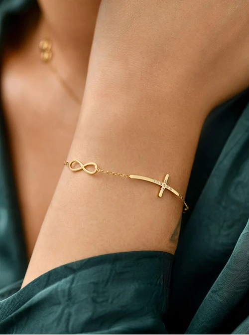 Bransoletka krzyż, skrzydełko, stal pozłacana S111821Z00