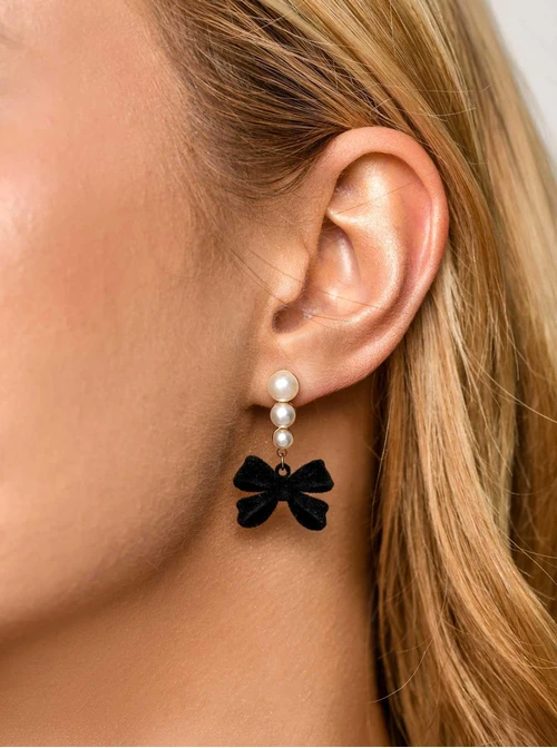 Kolczyki kokardki, perełki, stal pozłacana S211697Z01