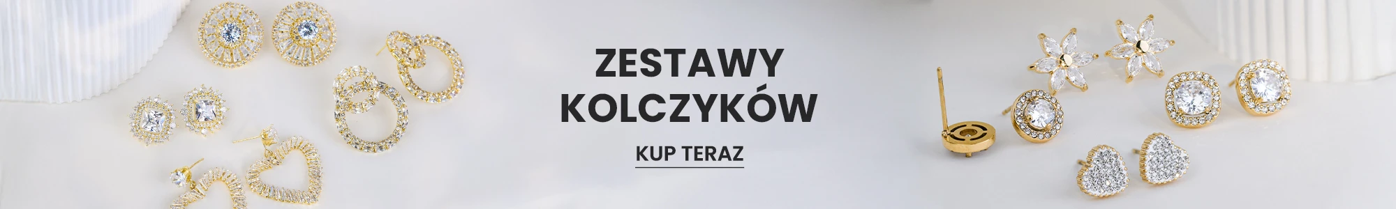 Zestaw złotych kolczyków z srebrnymi ozdobami - kolekcja biżuterii modowej.