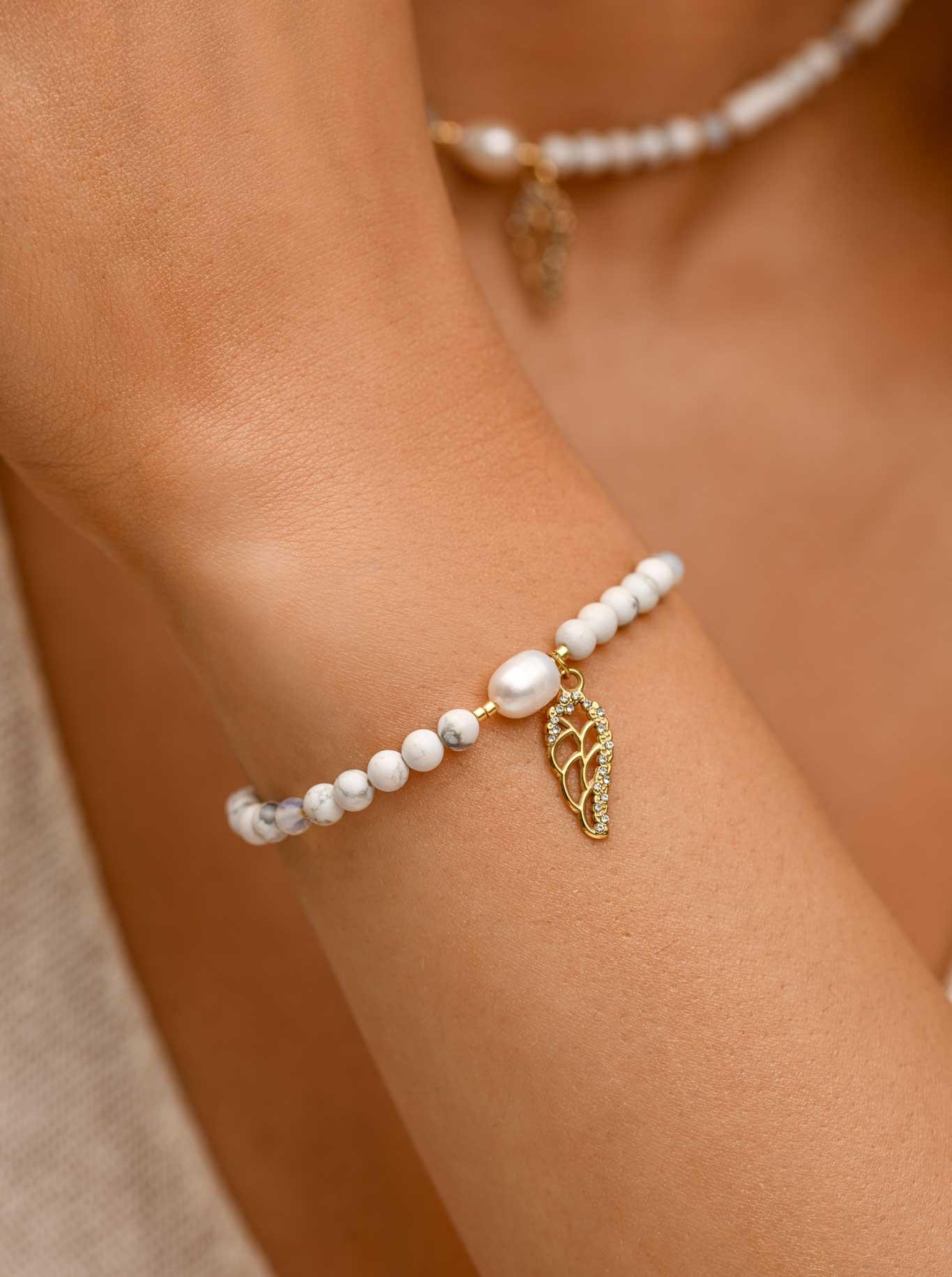 Bransoletka skrzydełko, perełka, Howlit, stal pozłacana S109399Z02